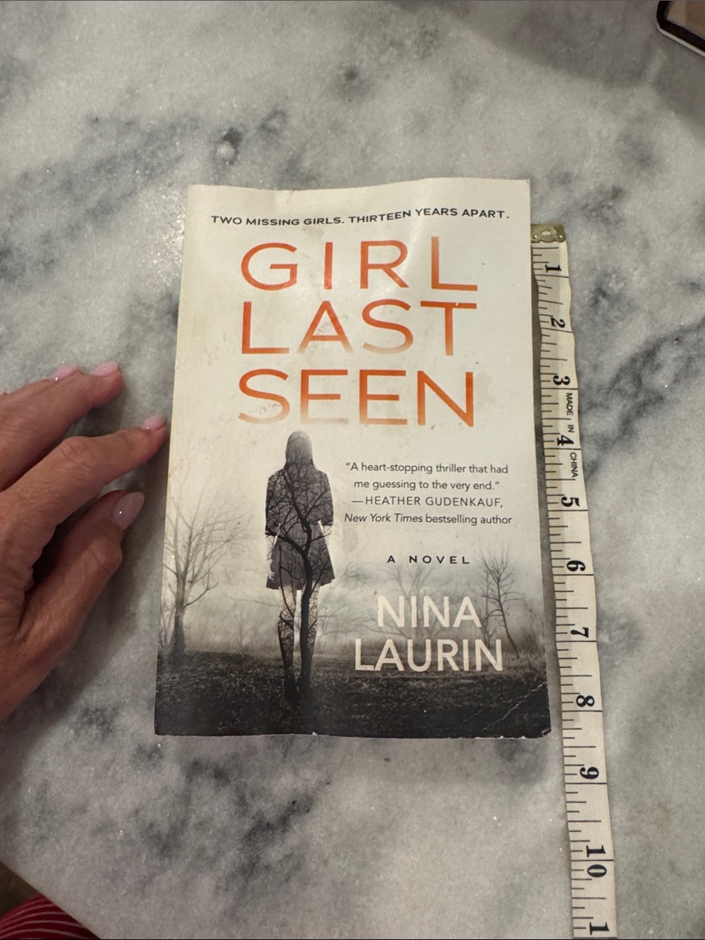 Girl Last Seen by Nina Laurin - White & Orange Paperback